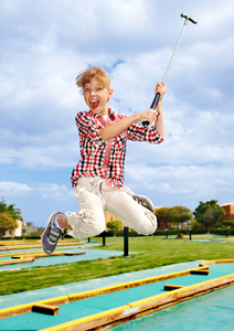 Girl Playing Mini Golf